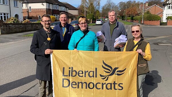 Liberal Democrat campaigners out delivering