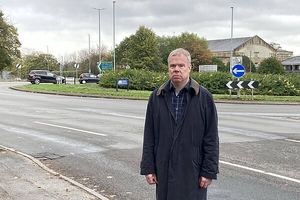 Chris Howley standing in front of the Lawnswood Roundabout