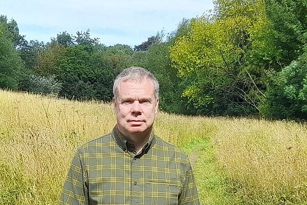 Chris Howley standing in Tetley fields