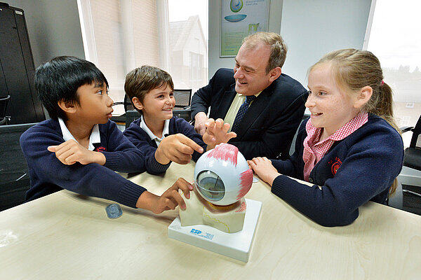 Ed Davey talking to children